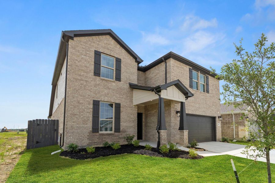 Front exterior of a new home in Bay Creek, Baytown, TX, highlighting curb appeal (Image 2). Front exterior of a new home in Bay Creek, Baytown, TX, highlighting curb appeal (Image 2).