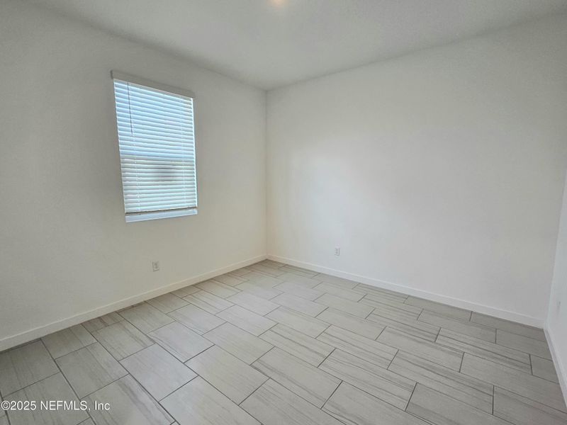 Spacious, unfurnished interior of a new home in Lakes at Bella Lago - Signature Series, Green Cove Springs (Image 23).