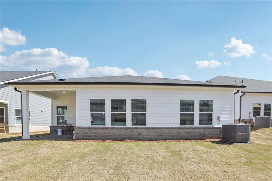 Exterior details and patio area of a home in Westmont Preserve, Powder Springs (Image 25).