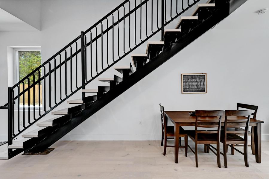 Dining area wood finished floors, and stairs