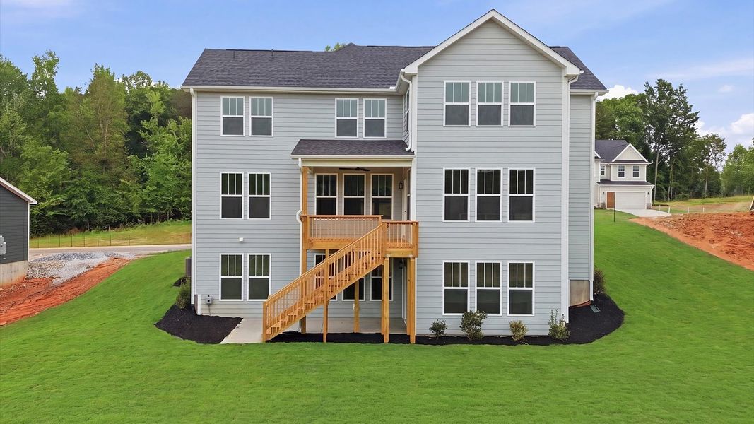 Exclusive rear covered porch and deck with accomplished detail and elevated outdoor living potential in Woodruff, SC