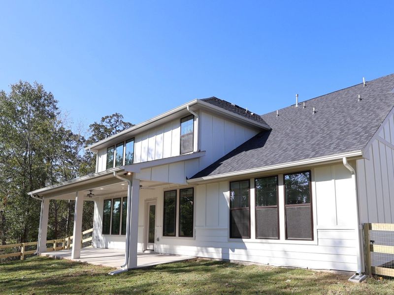 Exterior details and patio area of a home in The Oaks on 6th Street, Magnolia (Image 25).