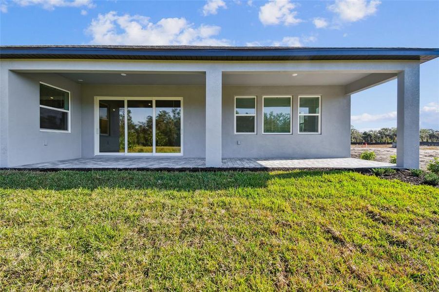 Exterior details and patio area of a home in Creeks Edge at Twin Rivers, Parrish (Image 3). Exterior details and patio area of a home in Creeks Edge at Twin Rivers, Parrish (Image 3).