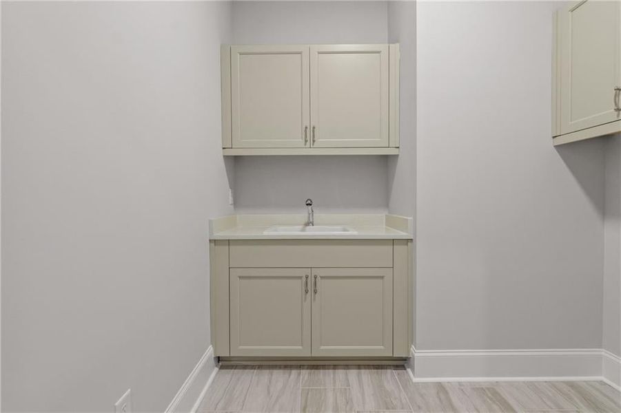 NICE DEEP LAUNDRY SINK SET IN A BUILT IN CABINET