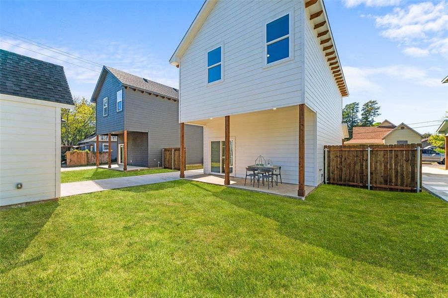 Rear view of property featuring a patio area