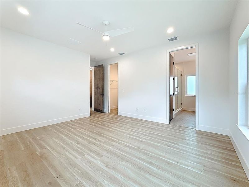 Elegant Primary Bedroom upstairs featuring a sleek en suite bath and abundant natural light. Elegant Primary Bedroom upstairs featuring a sleek en suite bath and abundant natural light.