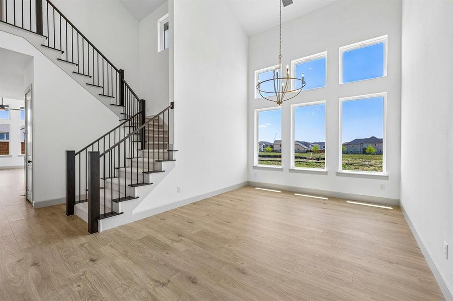 With soaring ceilings and a wall of windows, you'll love hosting grand dinner parties in this over the top dining room! With soaring ceilings and a wall of windows, you'll love hosting grand dinner parties in this over the top dining room!