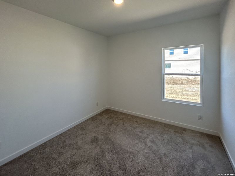 Spacious, unfurnished interior of a new home in Hennersby Hollow, San Antonio (Image 14).