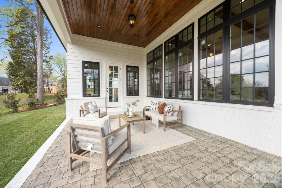 Rear porch is screened in but images were taken before it was finished.