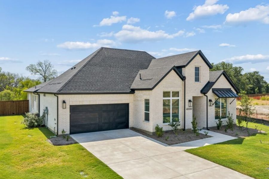 Front exterior of a new home in Chatham Reserve, Providence Village, TX, highlighting curb appeal (Image 2).