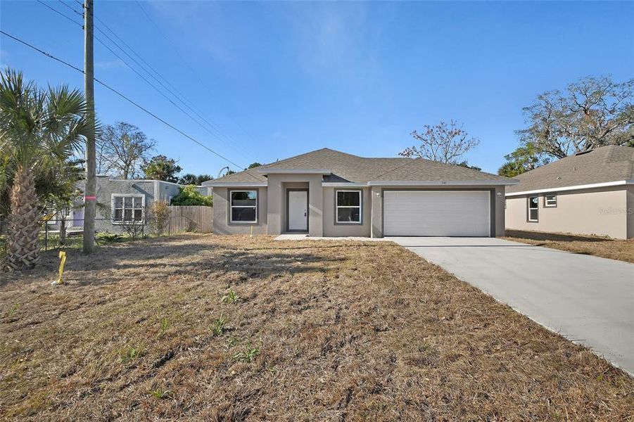 Front exterior of a new home in , Daytona Beach, FL, highlighting curb appeal (Image 2). Front exterior of a new home in , Daytona Beach, FL, highlighting curb appeal (Image 2).