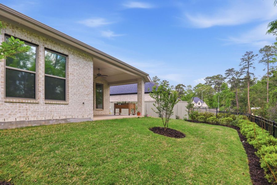 This perspective showcases the easy flow between the patio and the private lot.