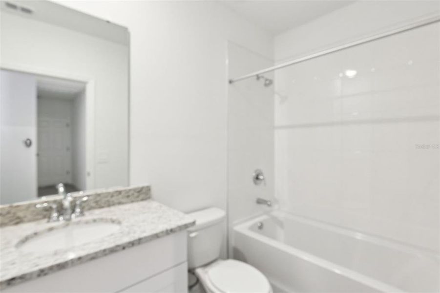 Furnished interior view inside a new home in Villamar - Classic Series, Winter Haven (Image 12). Furnished interior view inside a new home in Villamar - Classic Series, Winter Haven (Image 12).