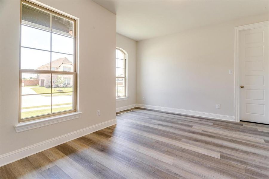 Unfurnished room with light wood-type flooring