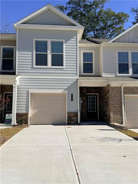 Front exterior of a new home in Morning Creek Forest, South Fulton, GA, highlighting curb appeal (Image 1).