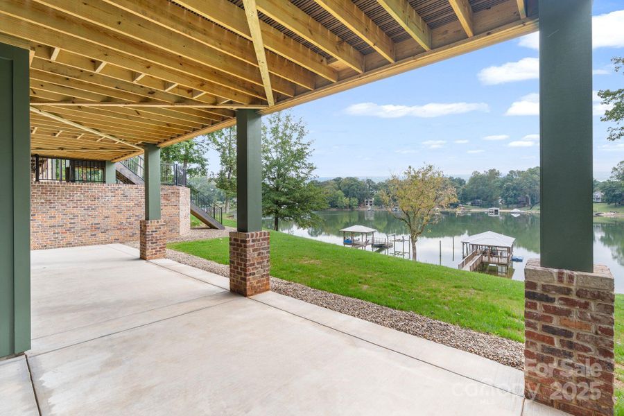 Covered lower level back patio accessible from the basement so you can head straight to the water Covered lower level back patio accessible from the basement so you can head straight to the water