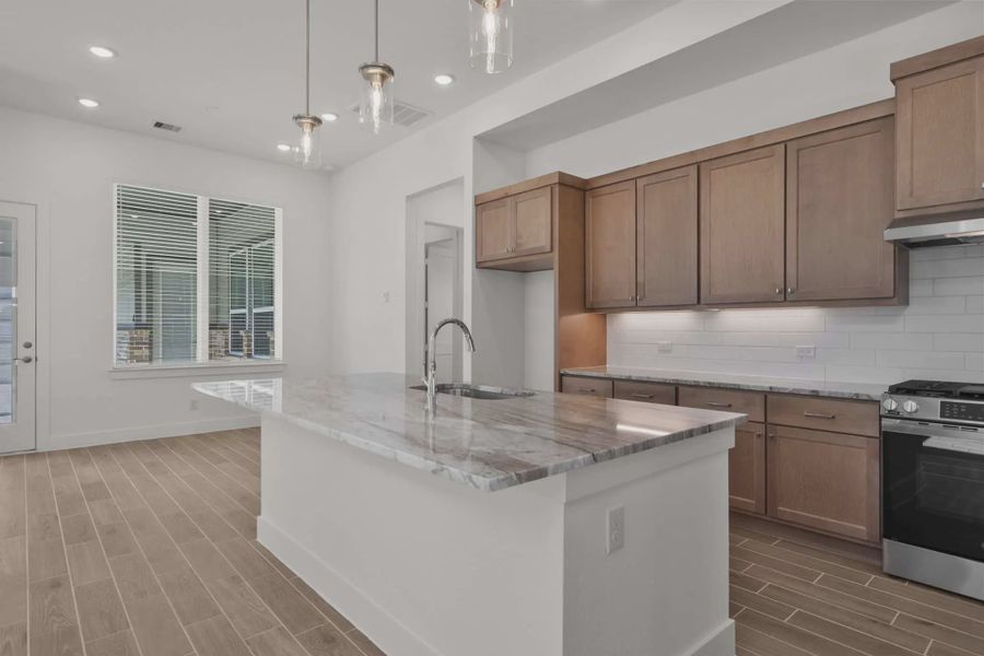 Representative furnished interior of a home built from the Sorenstam by Chesmar Homes in Riceland Alley Loads, Mont Belvieu (Image 7).