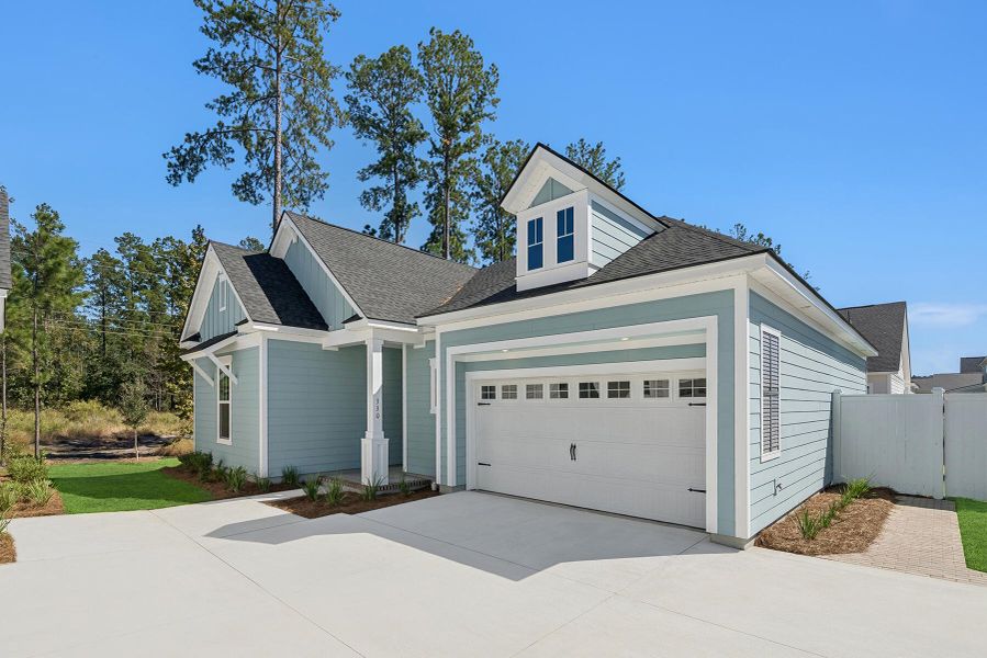 Front exterior of a new home in Nexton – Midtown – The Garden Collection, Summerville, SC, highlighting curb appeal (Image 1). Front exterior of a new home in Nexton – Midtown – The Garden Collection, Summerville, SC, highlighting curb appeal (Image 1).