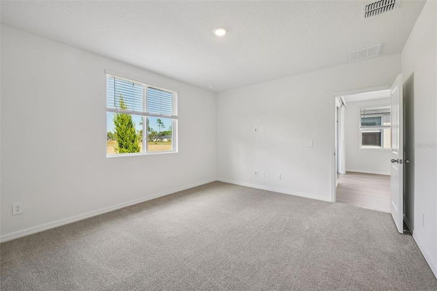 Spacious, unfurnished interior of a new home in Ridgehaven - Villas, Ormond Beach (Image 26).