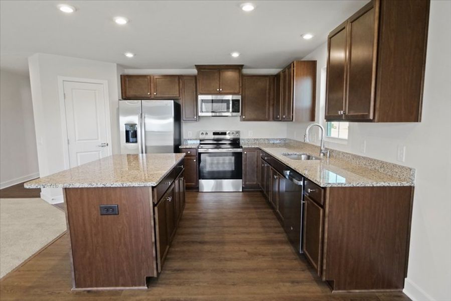 Furnished interior view inside a new home in Reidville Town Center Cottages, Duncan (Image 6).