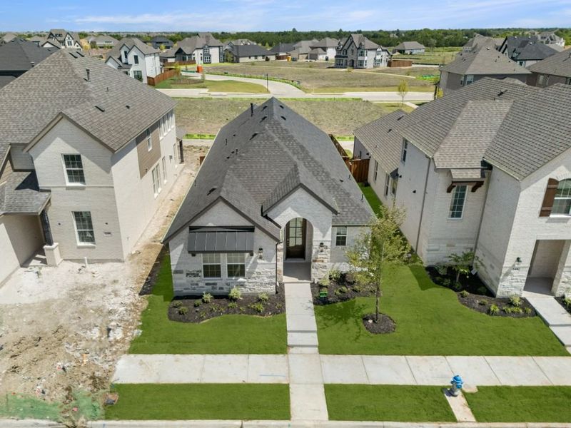 Image 44 representing the Cypress by UnionMain Homes in Edgewater, Fate, TX.