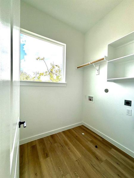 Off the bedrooms on the third floor is conveniently located the walk-in utility room with a hanging rod, built-ins and storage space.