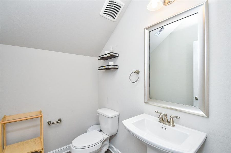 Half bath under the stairs.