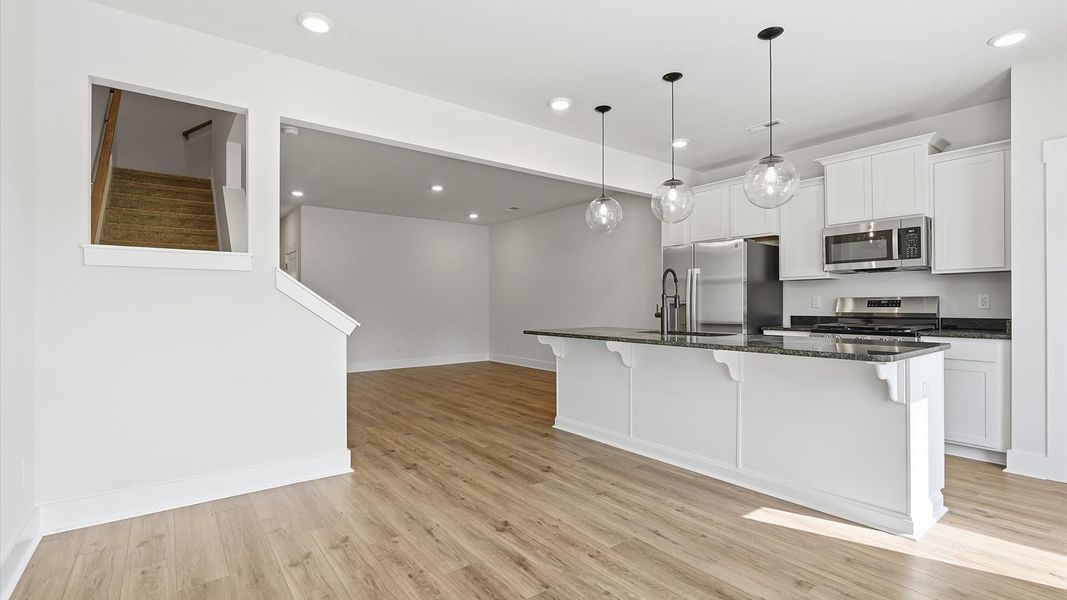Inviting breakfast area with a seamless connection to the kitchen for everyday living at the Marion Square community Inviting breakfast area with a seamless connection to the kitchen for everyday living at the Marion Square community