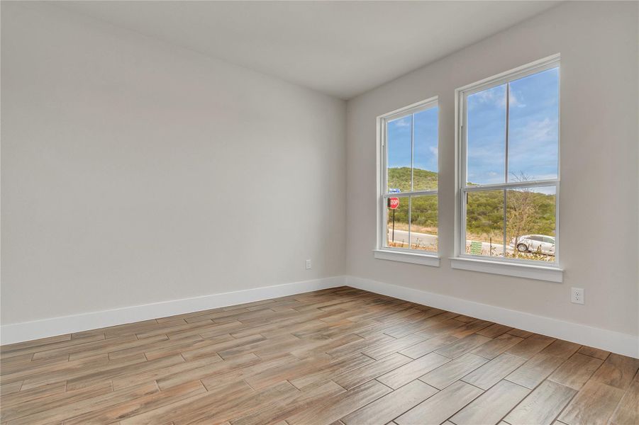 Ceramic tile flooring and ample natural light define this inviting space.