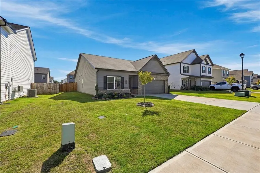 Front exterior of a new home in , Cartersville, GA, highlighting curb appeal (Image 21).