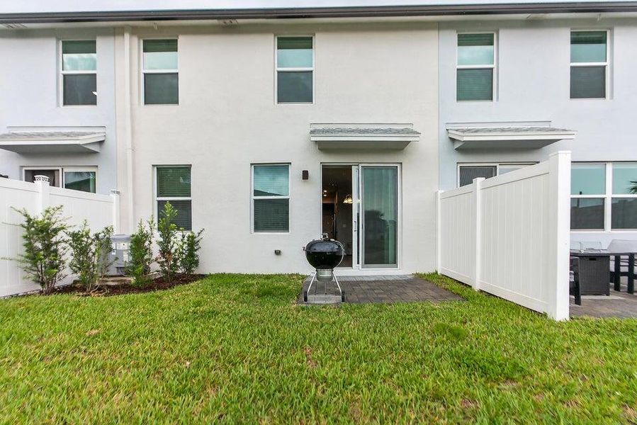 Exterior details and patio area of a home in Enclave at Mangonia Park, West Palm Beach (Image 3).