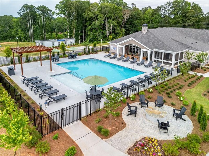 Front exterior of a new home in The Courtyards at Bailey Farm, Dacula, GA, highlighting curb appeal (Image 1).
