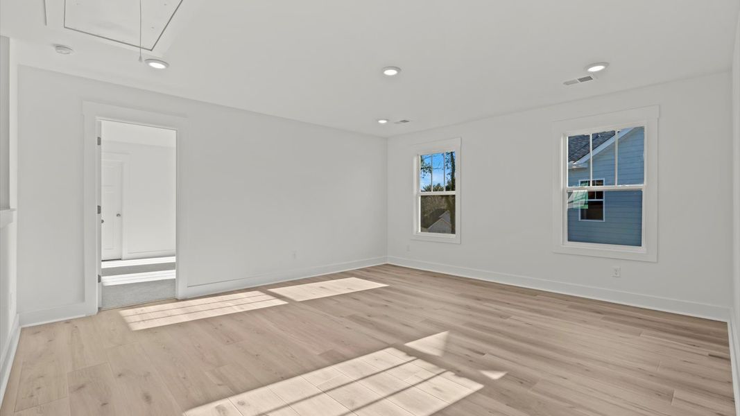 Hardwood flooring enhances the versatility of this elegant upper-level loft space