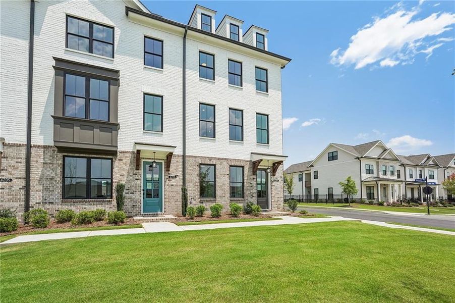 Front exterior of a new home in Millcroft Townhomes, Buford, GA, highlighting curb appeal (Image 32). Front exterior of a new home in Millcroft Townhomes, Buford, GA, highlighting curb appeal (Image 32).