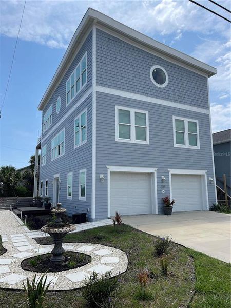 Front exterior of a new home in , Flagler Beach, FL, highlighting curb appeal (Image 1). Front exterior of a new home in , Flagler Beach, FL, highlighting curb appeal (Image 1).