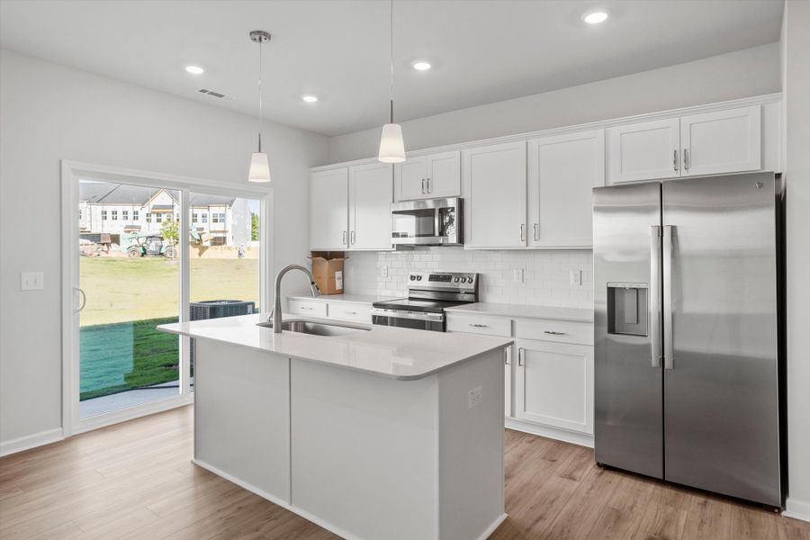 Furnished interior view inside a new home in West Main Townhomes, Sanford (Image 5).