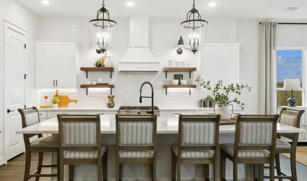 Kitchen with pendant lighting and floating shelves