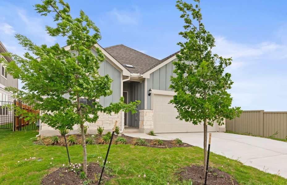 Front exterior of a new home in Santa Rita Ranch, Liberty Hill, TX, highlighting curb appeal (Image 23).