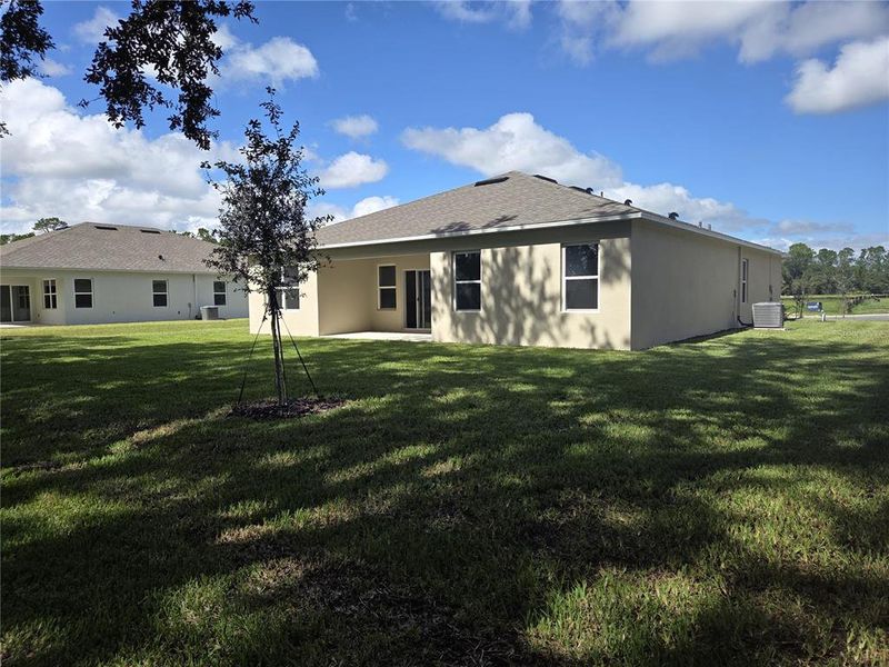 Exterior details and patio area of a home in Wexford Cove, Ormond Beach (Image 2).
