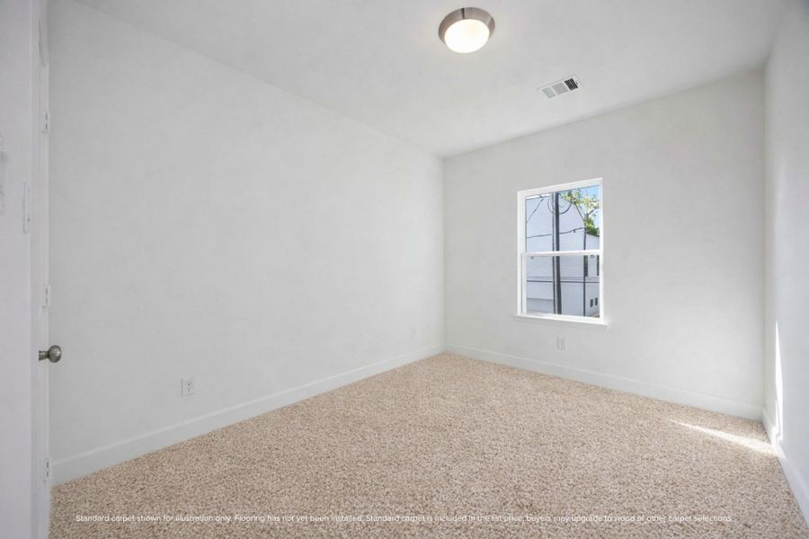 Another secondary bedroom with its own walk-in closet and flexible layout.