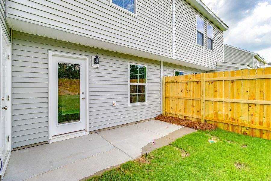 Exterior details and patio area of a home in Padgett Commons, Hopkins (Image 3).