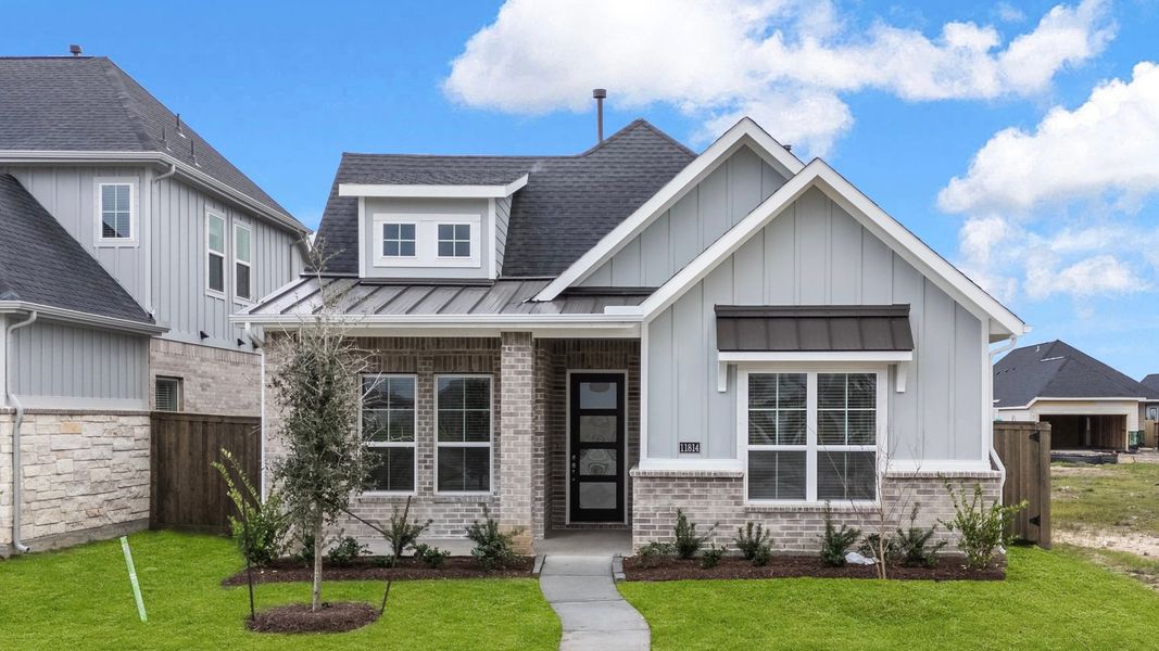Front exterior of a new home in Riceland, Mont Belvieu, TX, highlighting curb appeal (Image 17).