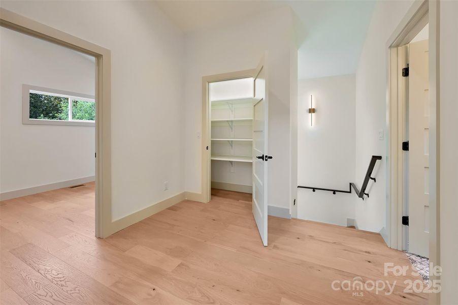 upstairs to 2 bedrooms, flex space, guest bath and storage