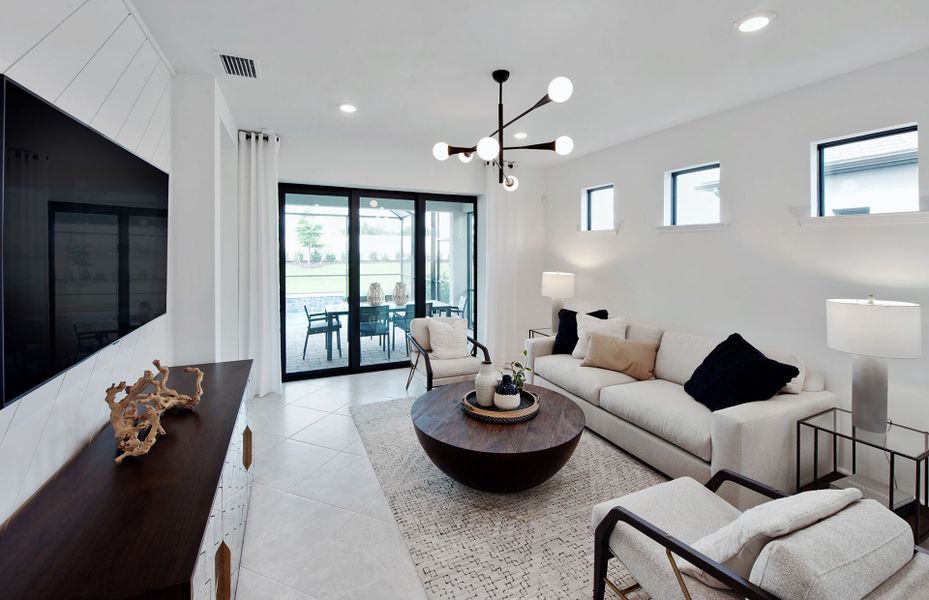 Sliding glass door leading to covered lanai and pool