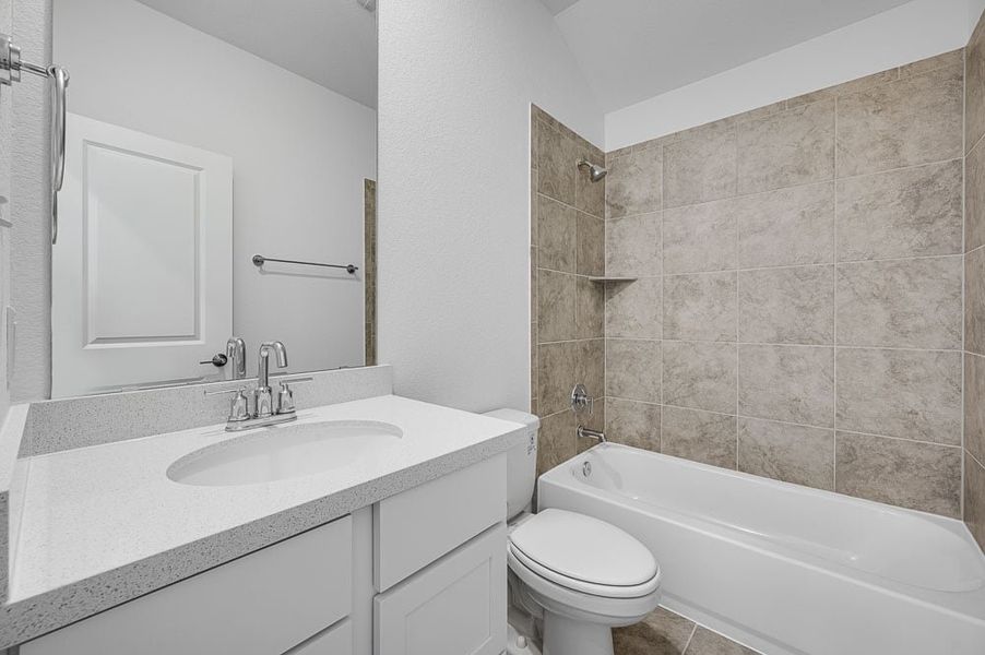 Representative furnished interior of a home built from the Mockingbird by Taylor Morrison in Longview 50s, Del Valle (Image 6).
