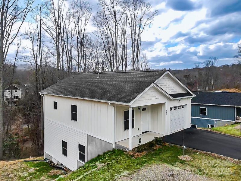 Front exterior of a new home in , Asheville, NC, highlighting curb appeal (Image 16).