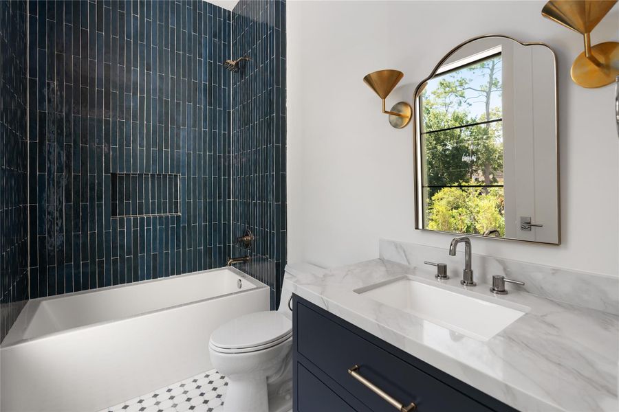 An additional secondary bedroom thoughtfully finished with bespoke tile and elegant fixtures An additional secondary bedroom thoughtfully finished with bespoke tile and elegant fixtures