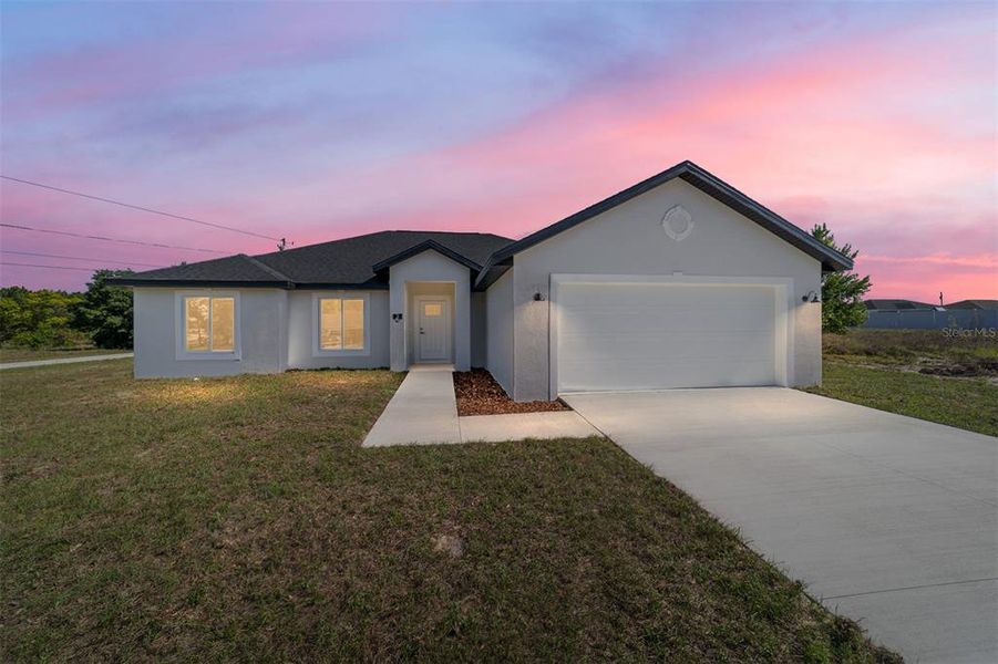 Front exterior of a new home in , Ocala, FL, highlighting curb appeal (Image 29).