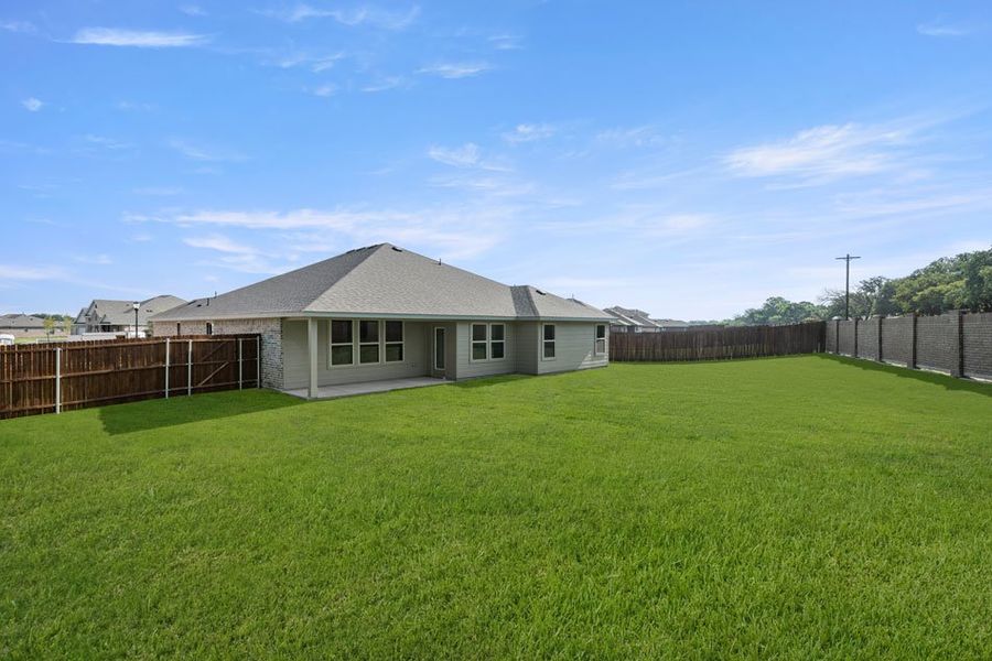 Front exterior of a new home in Stone Eagle, Azle, TX, highlighting curb appeal (Image 12). Front exterior of a new home in Stone Eagle, Azle, TX, highlighting curb appeal (Image 12).