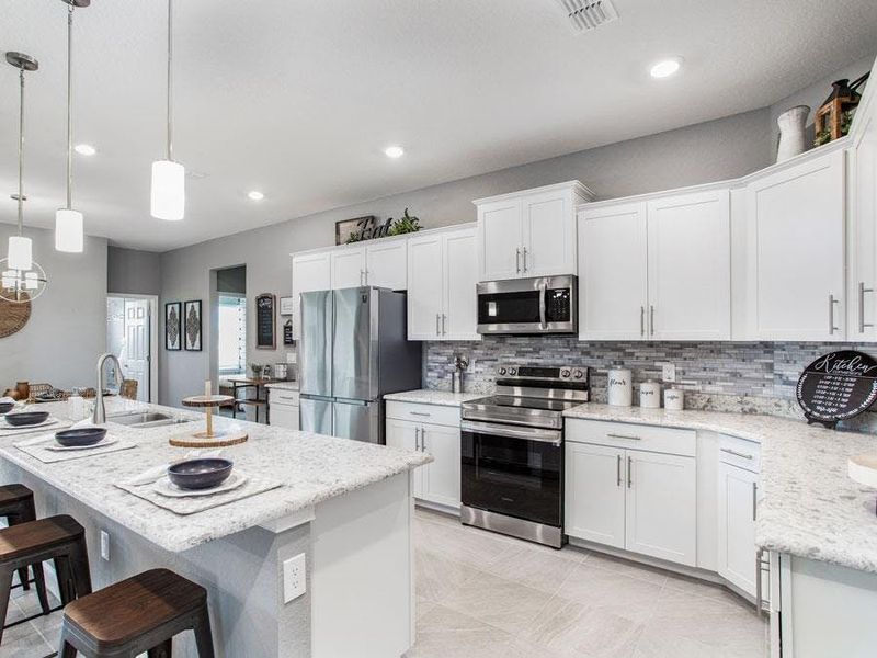 Your well-appointed kitchen provides plenty of cabinet and counter space - Waylyn by Highland Homes